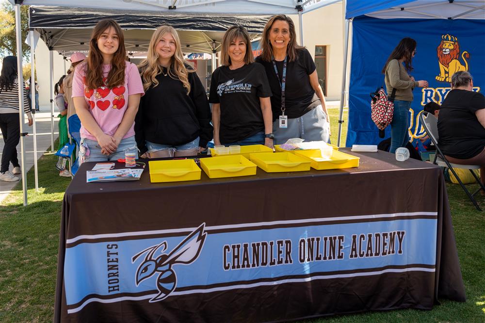 Chandler Online Academy students and staff smile by their booth.
